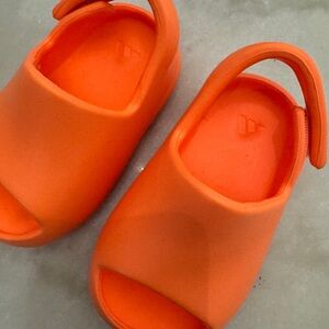 Yeezy.   Kids Orange Slide Sandals